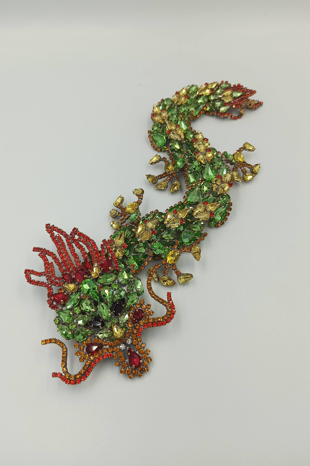 Handmade rhinestone brooch with a green Chinese dragon