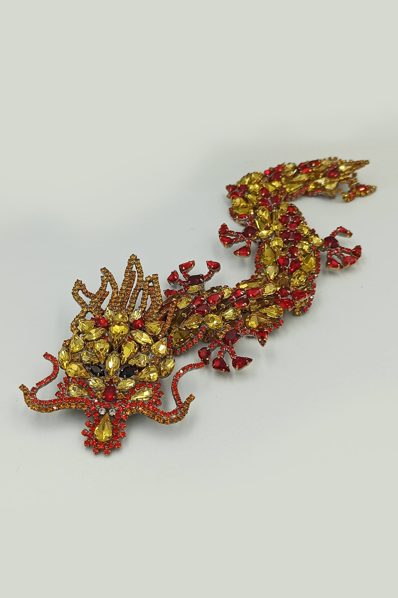 Handmade rhinestone brooch with a yellow Chinese dragon