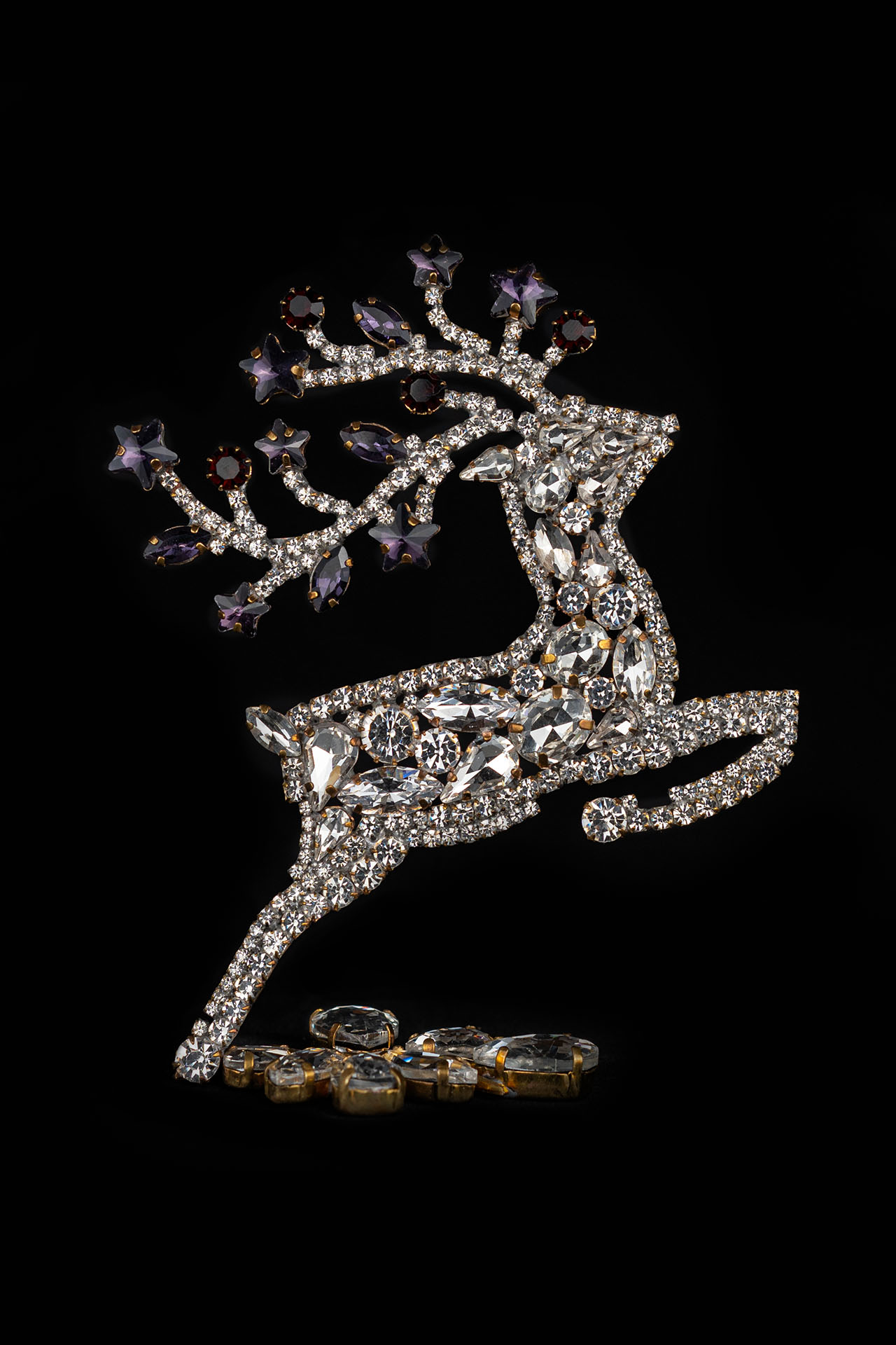 Decorative reindeer figurine with clear rhinestones - facing right