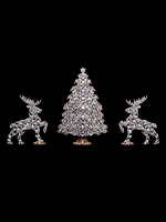 nativity scene and two dainty dazzling christmas trees festive colours