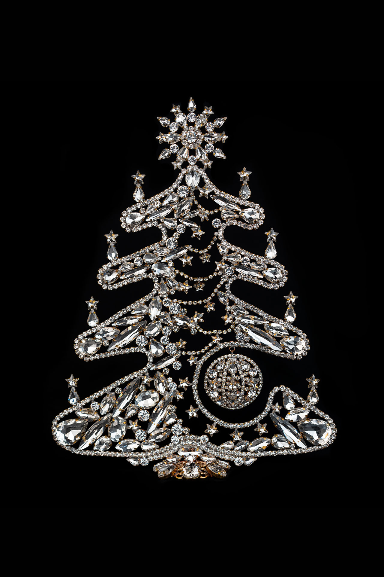 Glittering rhinestone Christmas tree in the shape of a gingerbread