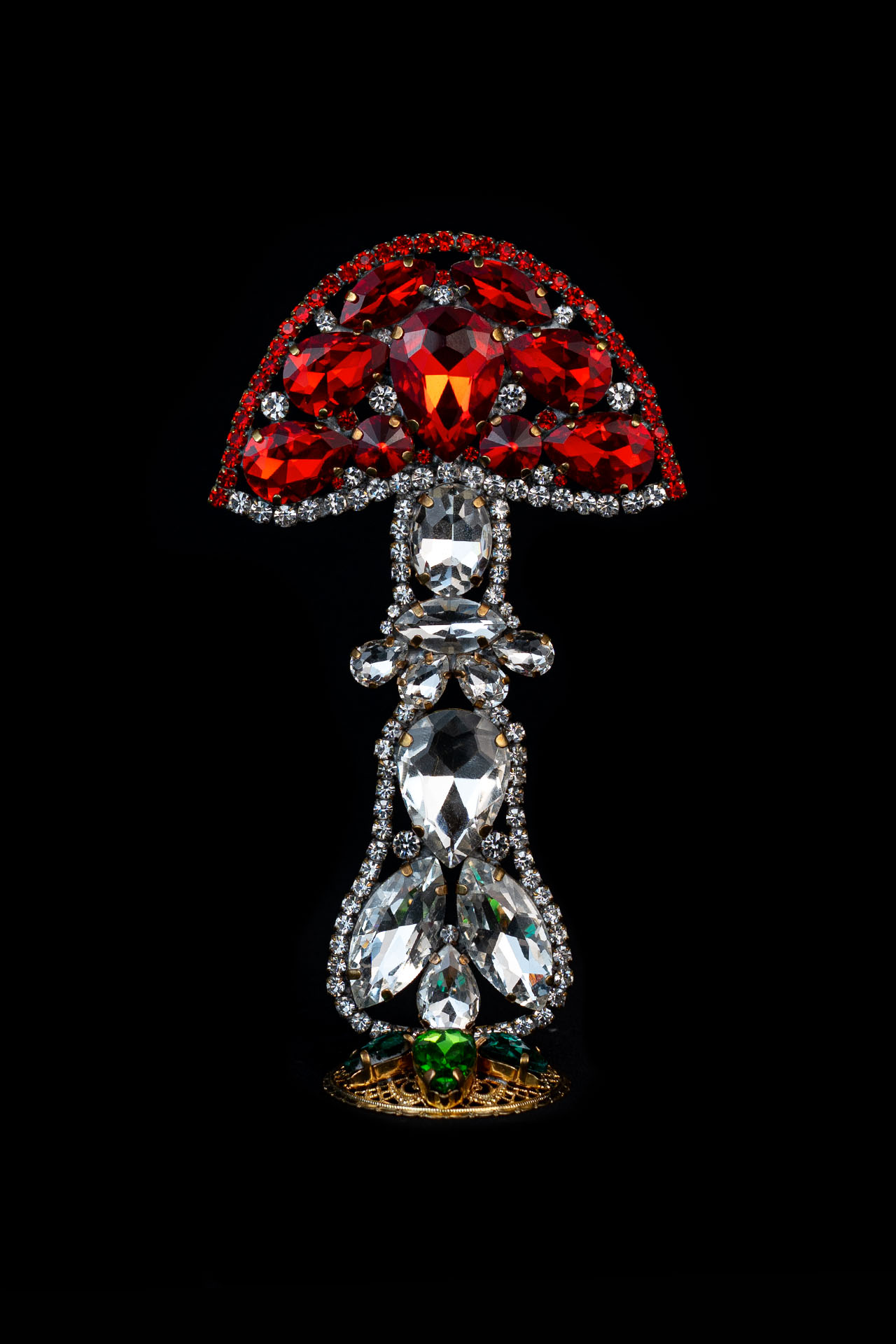 Handmade mushroom decoration made from red and clear rhinestones