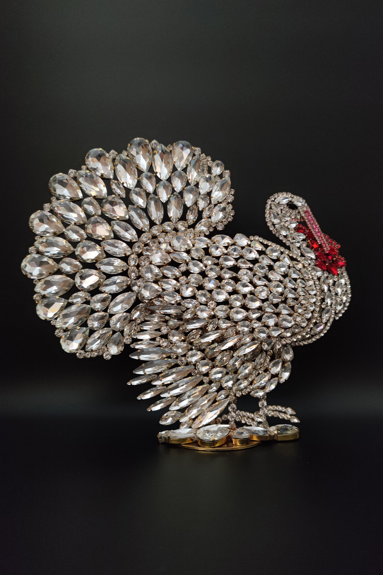 A luxurious, large turkey decoration for the table, crafted from clear rhinestone crystals.