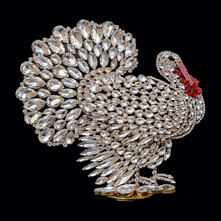 A luxurious, large turkey decoration for the table, crafted from clear rhinestone crystals.