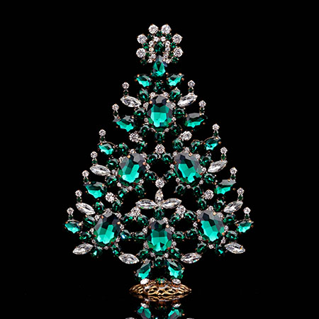 Decorated Christmas tree with green rhinestones ornaments.