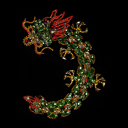Handmade rhinestone brooch with a green Chinese dragon. 