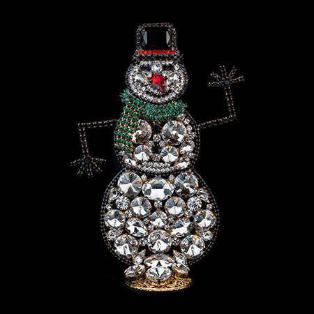Handmade playful rhinestone snowman figurine.