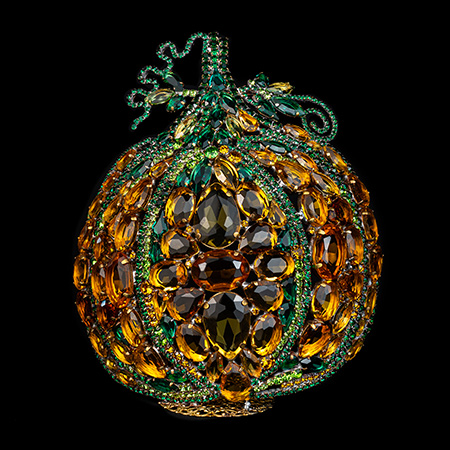 Bedazzled pumpkin decoration adorned with shimmering rhinestones.