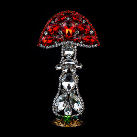 Handmade mushroom decoration made from red and clear rhinestones.